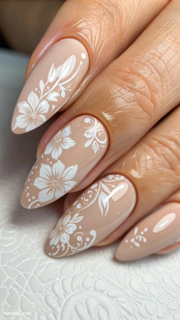 classy nude nails Nude base with white floral designs