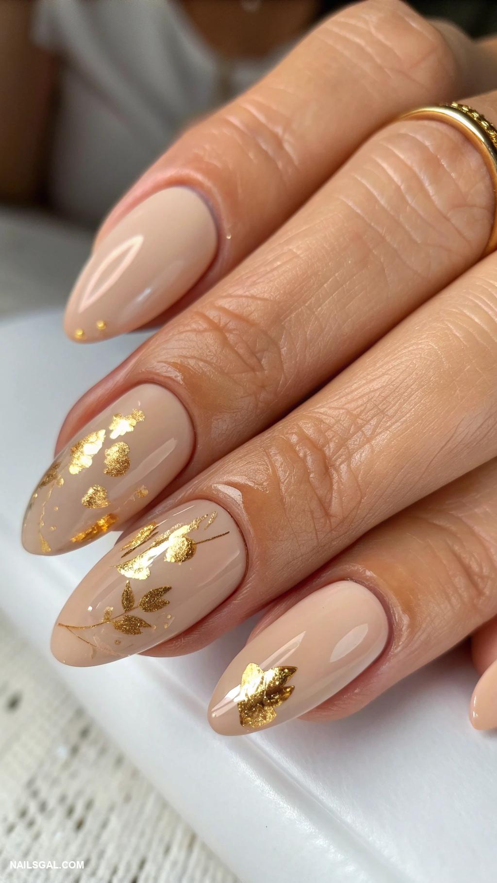 classy nude nails Nude with gold foil accents