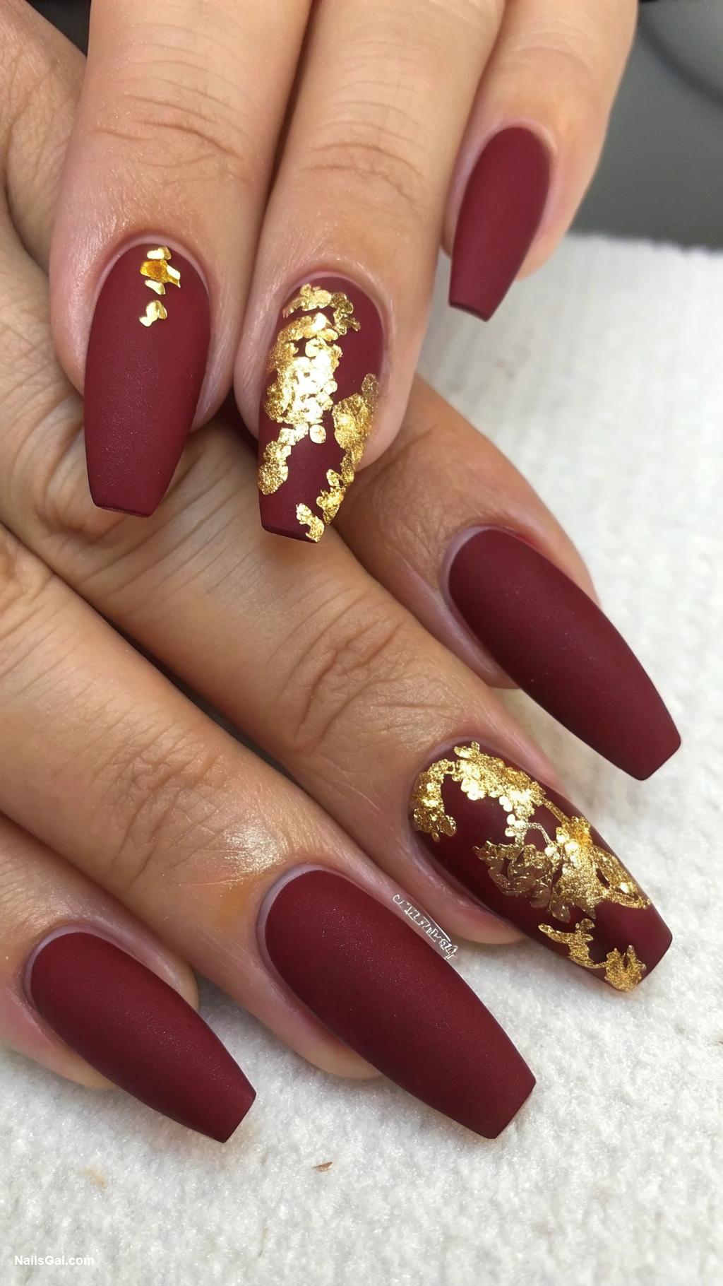 fall coffin nails Matte burgundy with gold foil accents