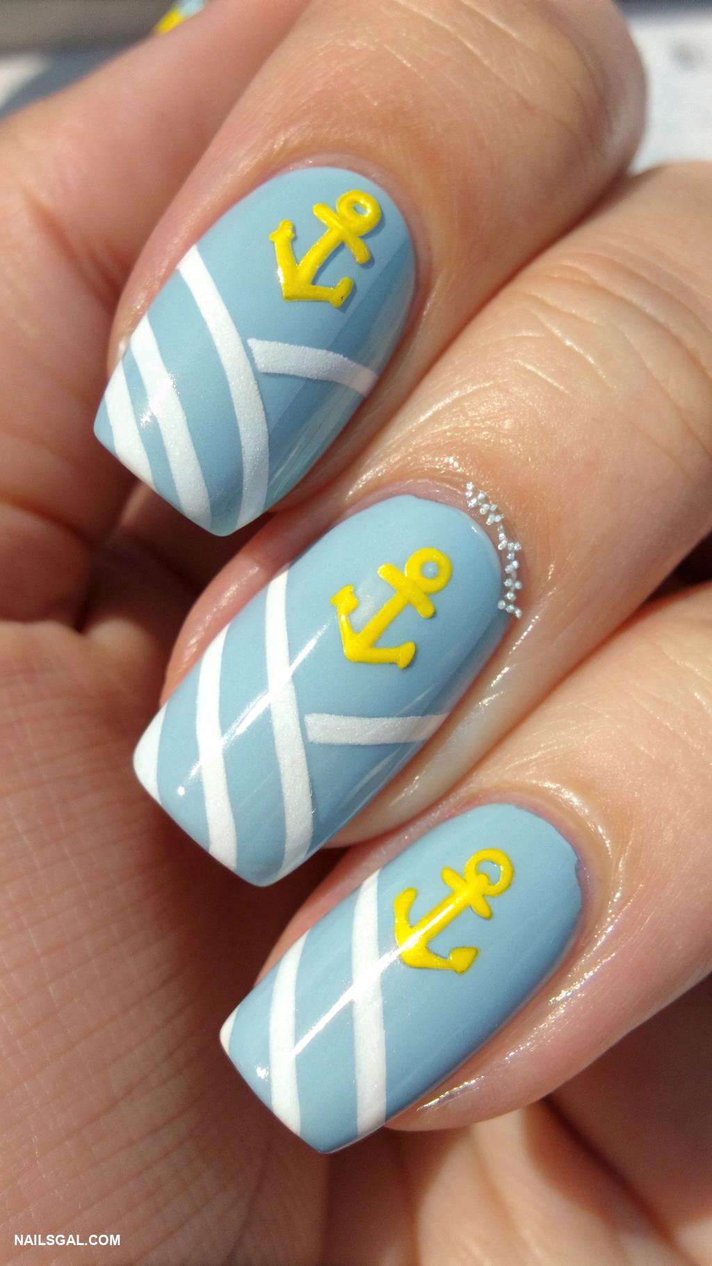 blue and yellow nails Nautical theme with blue stripes and yellow anchors