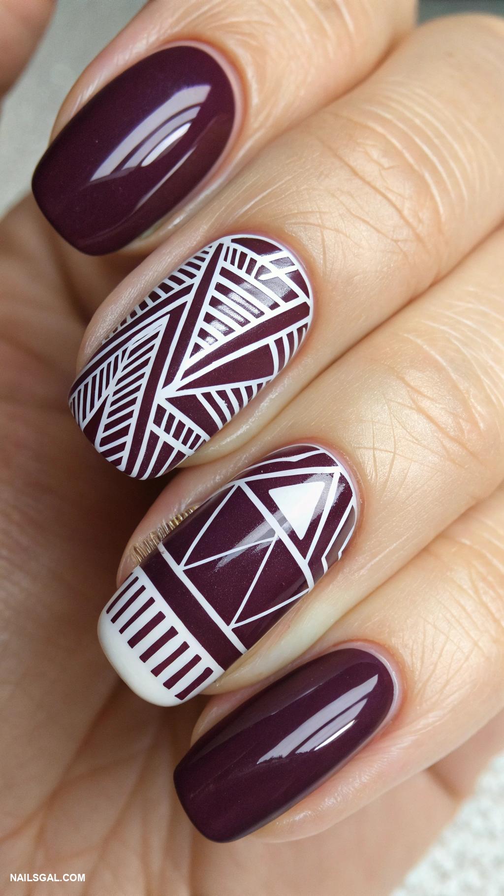 dark plum nails Geometric patterns in dark plum and white