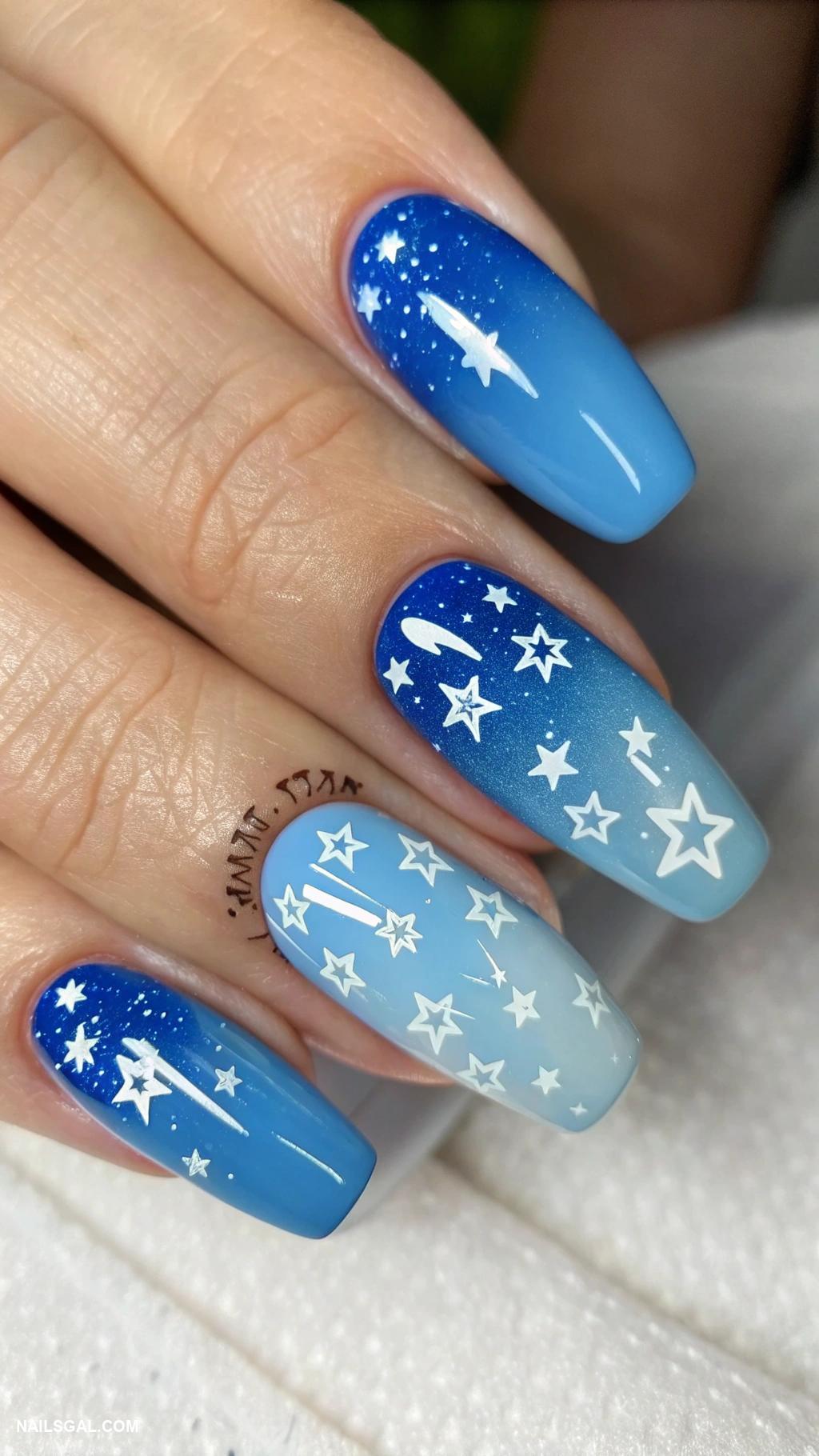 blue ombre nails Baby blue to cobalt with star patterns