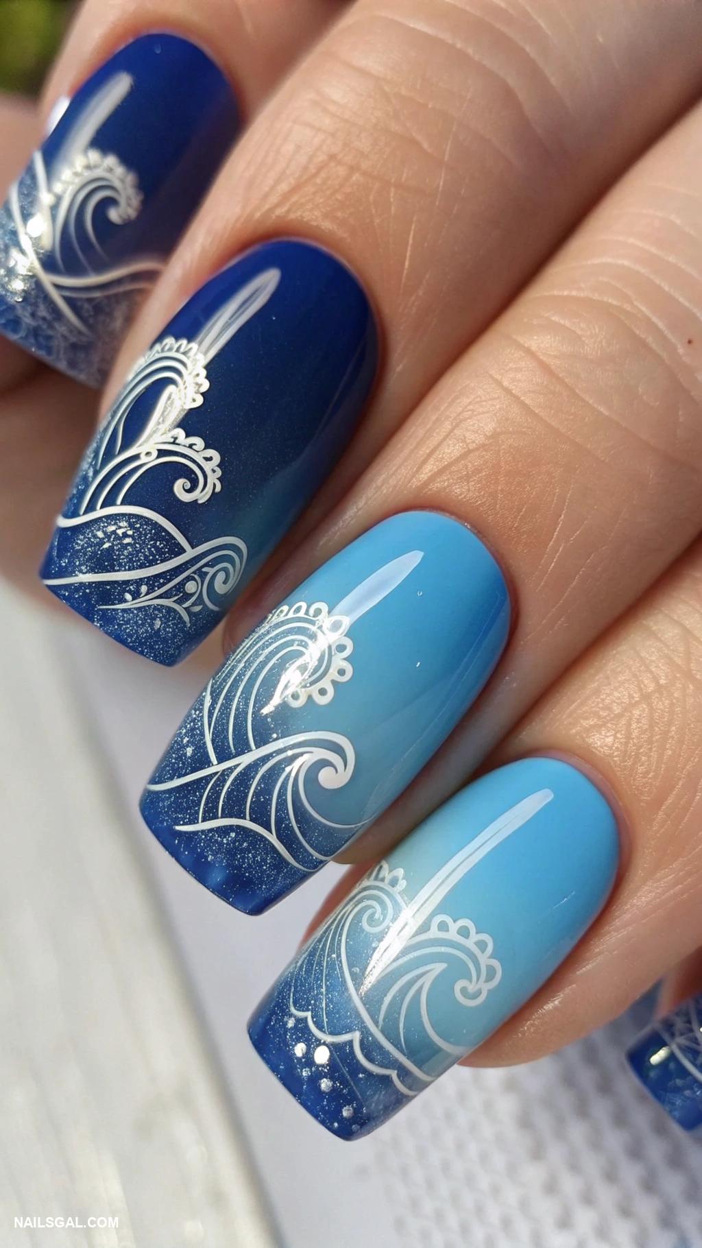 blue ombre nails Blue ombre with abstract wave motifs