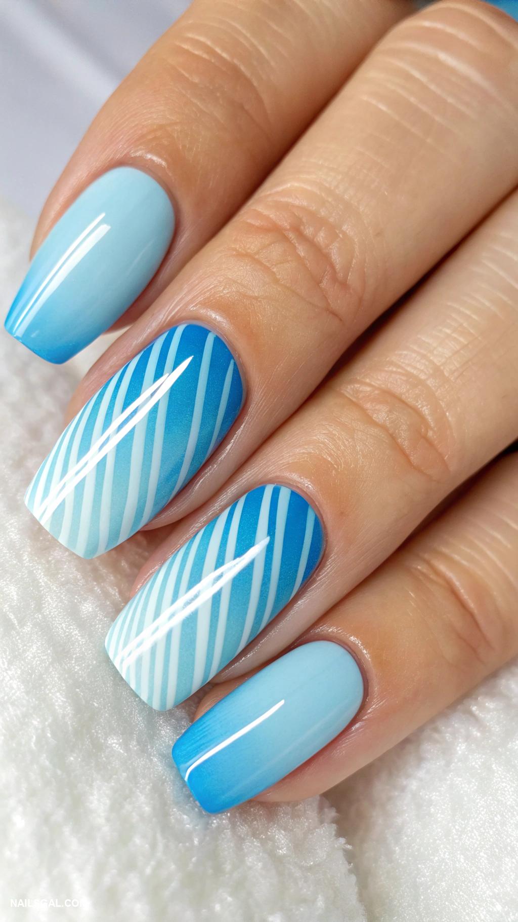 blue ombre nails Cerulean to sky blue with chic stripes