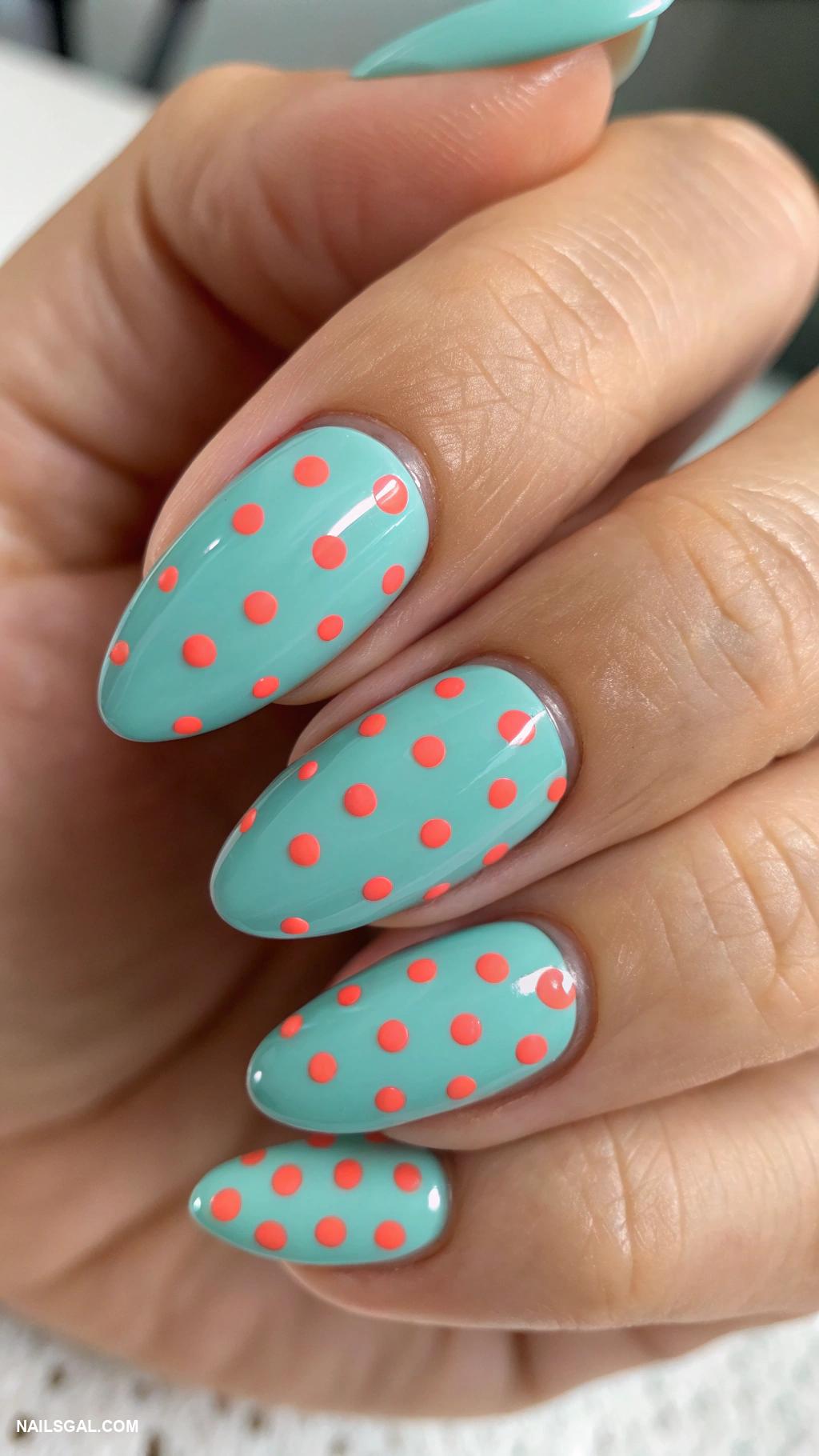 coral and teal nails Teal base with coral polka dots