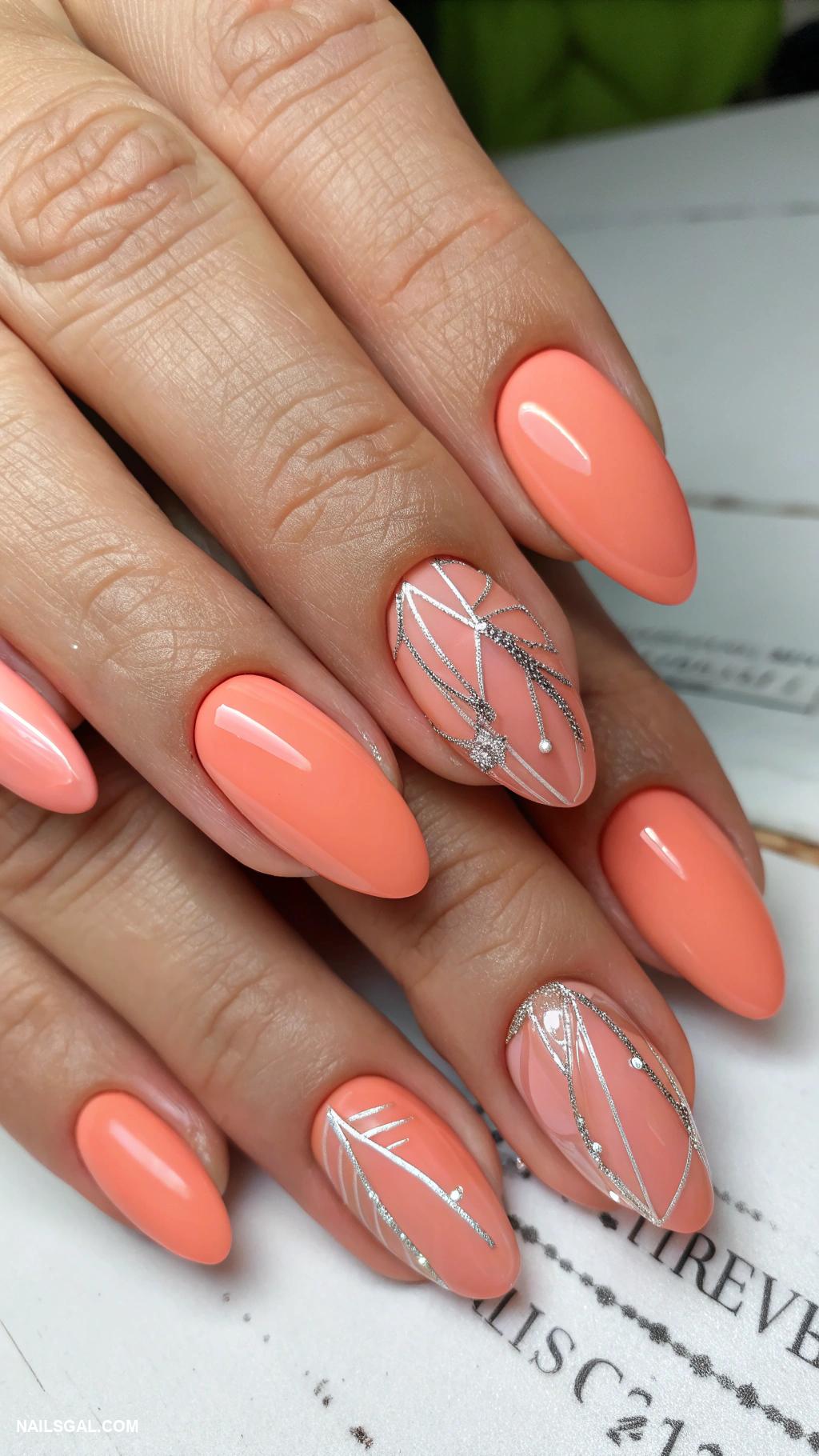 mother of the groom nails Coral nails with subtle metallic accents
